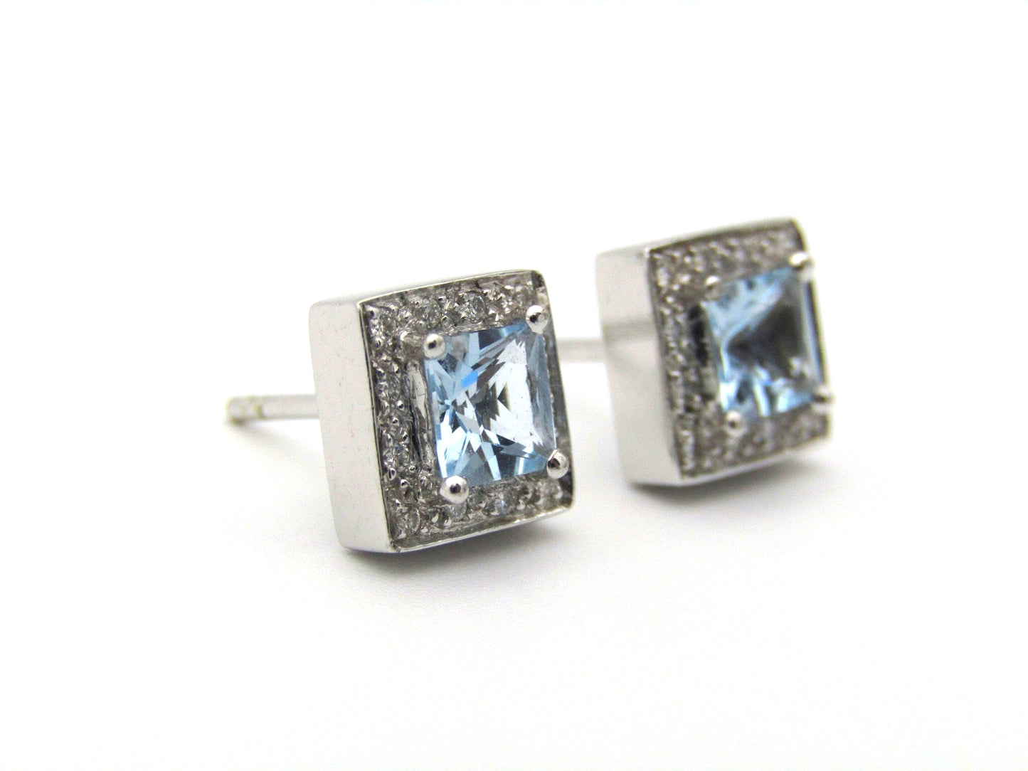 A pair of 18kt gold Blue Topaz and diamond earrings.