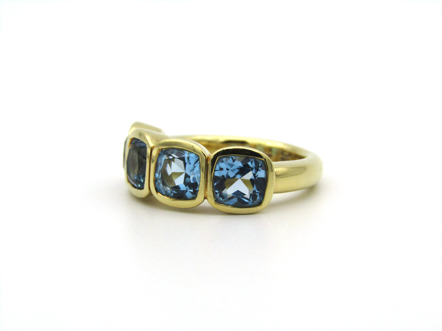 18K gold blue topaz ring.
