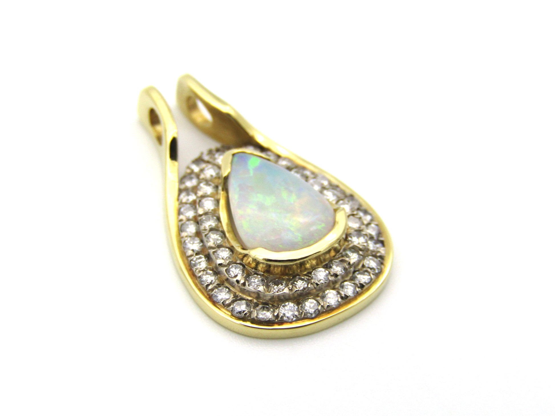 18K gold opal and diamond pendant.