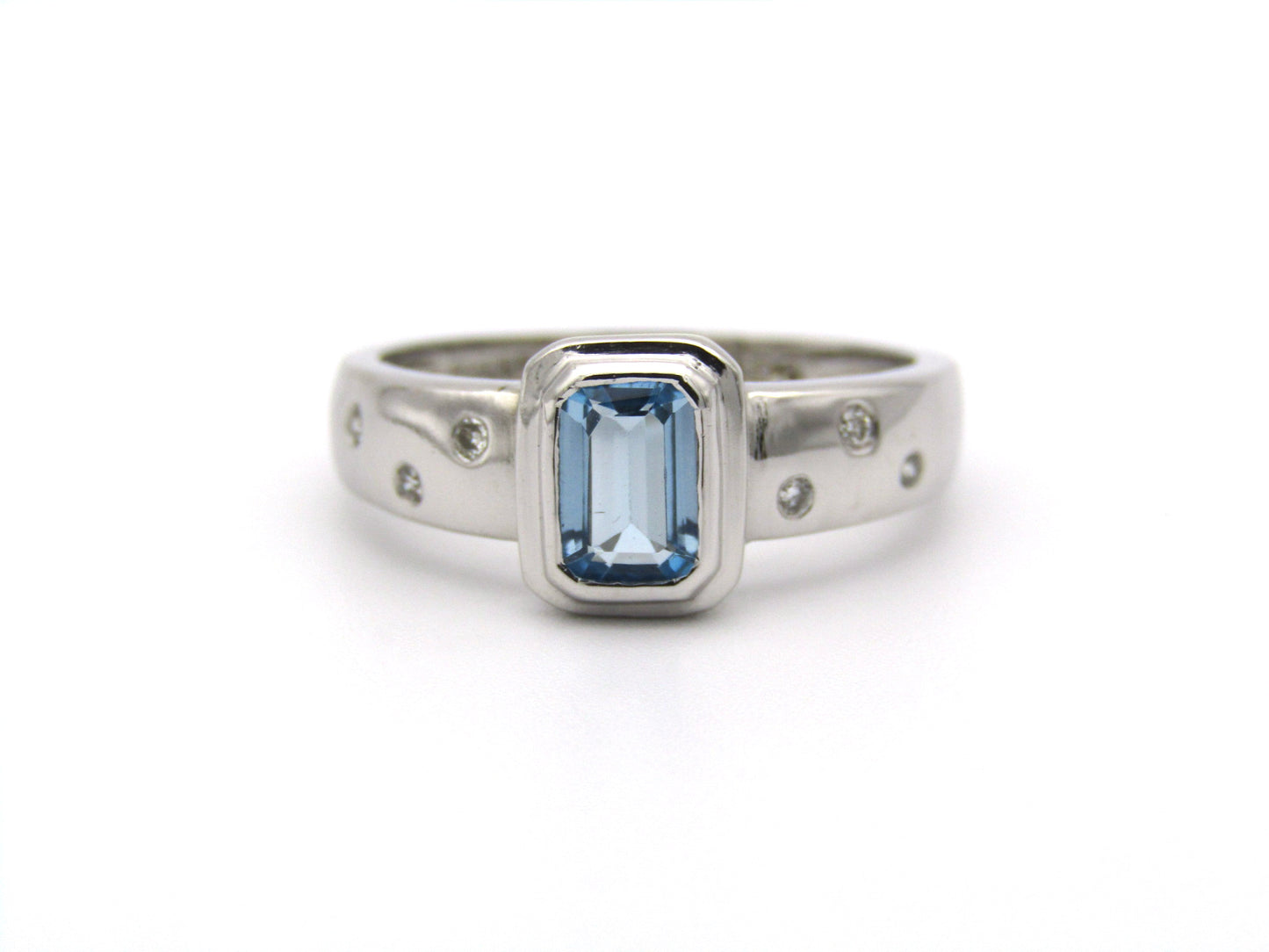 9K gold blue topaz and diamond ring by Browns.
