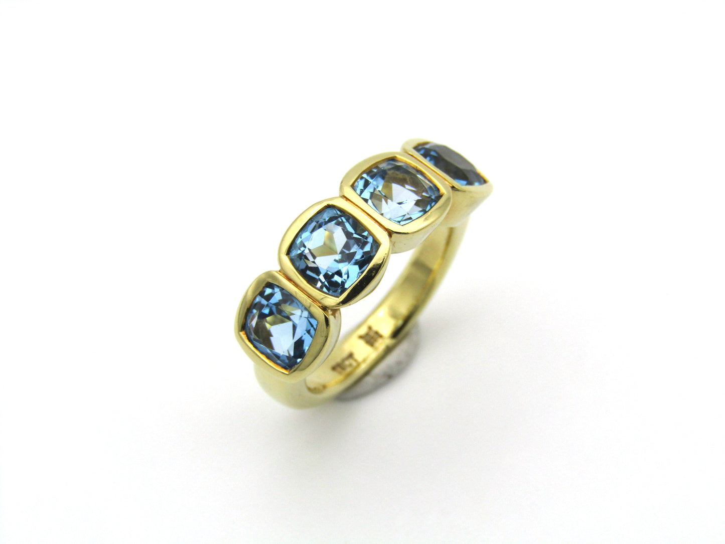 18K gold blue topaz ring.