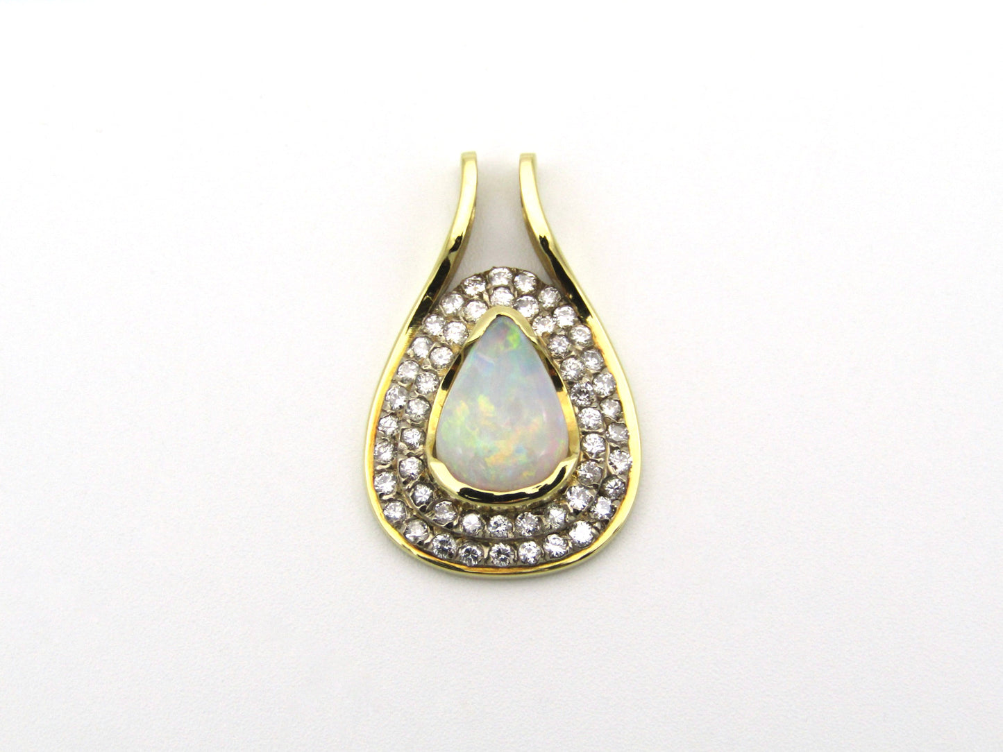 18K gold opal and diamond pendant.