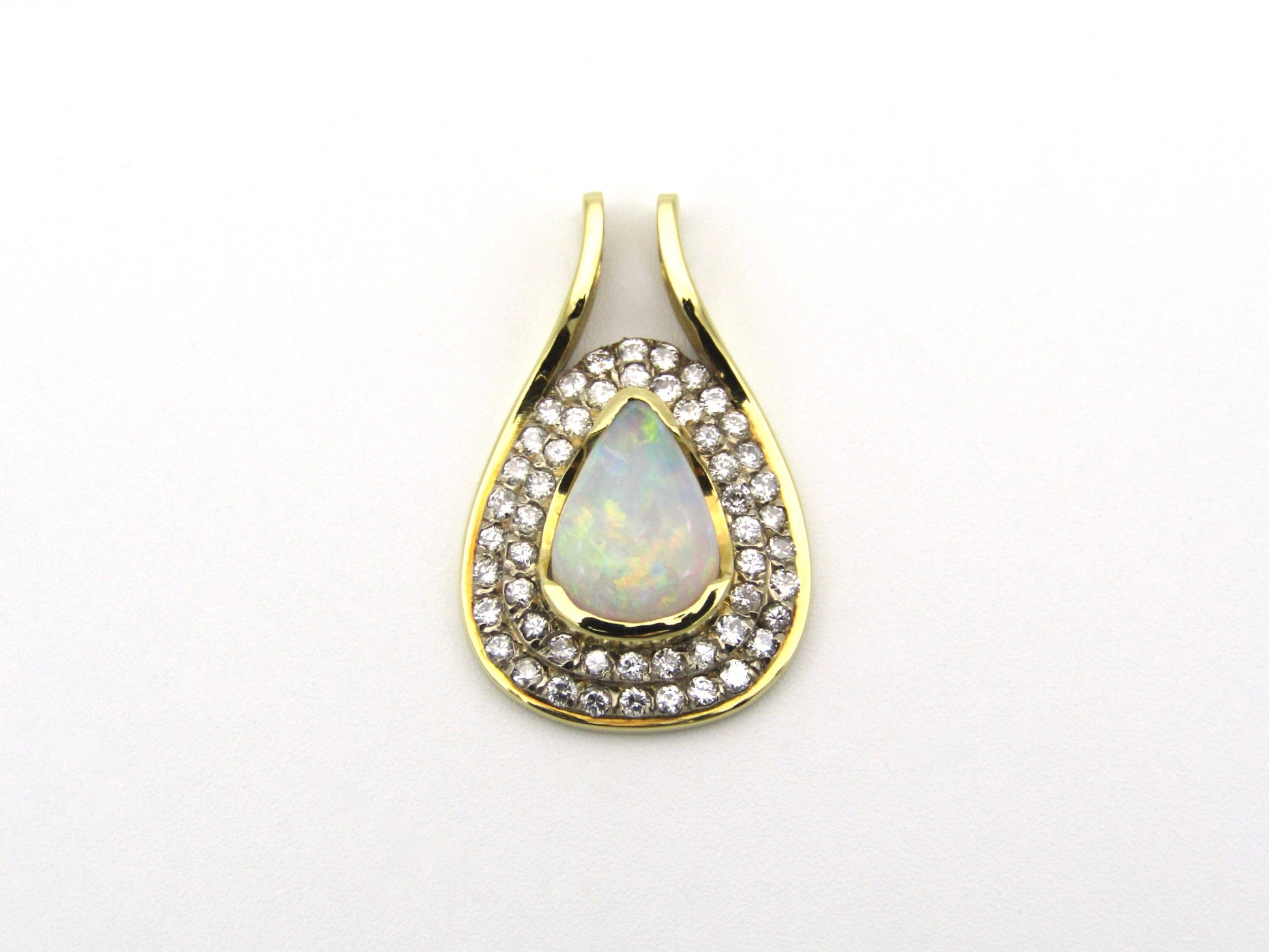 18K gold opal and diamond pendant.