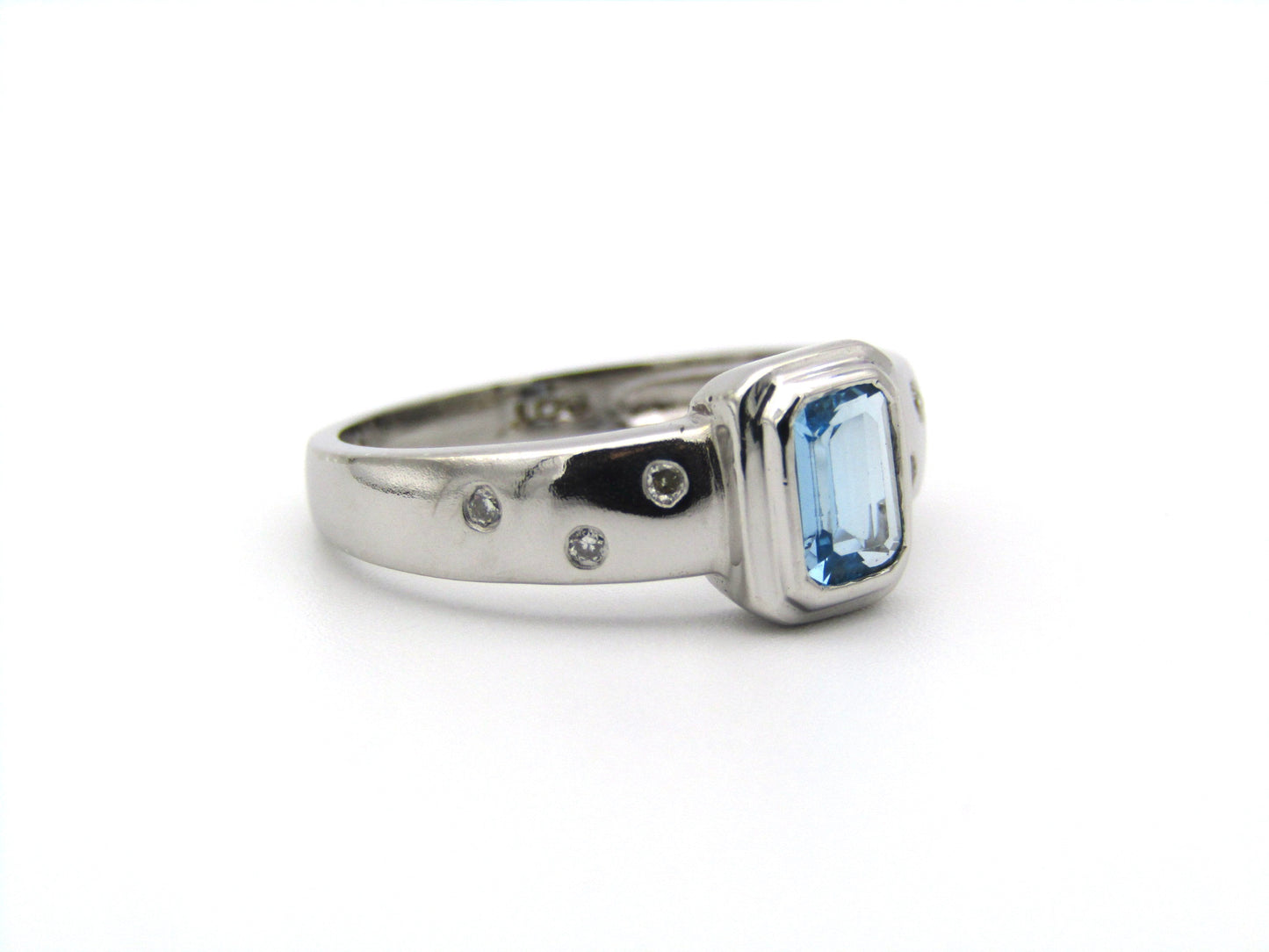9K gold blue topaz and diamond ring by Browns.