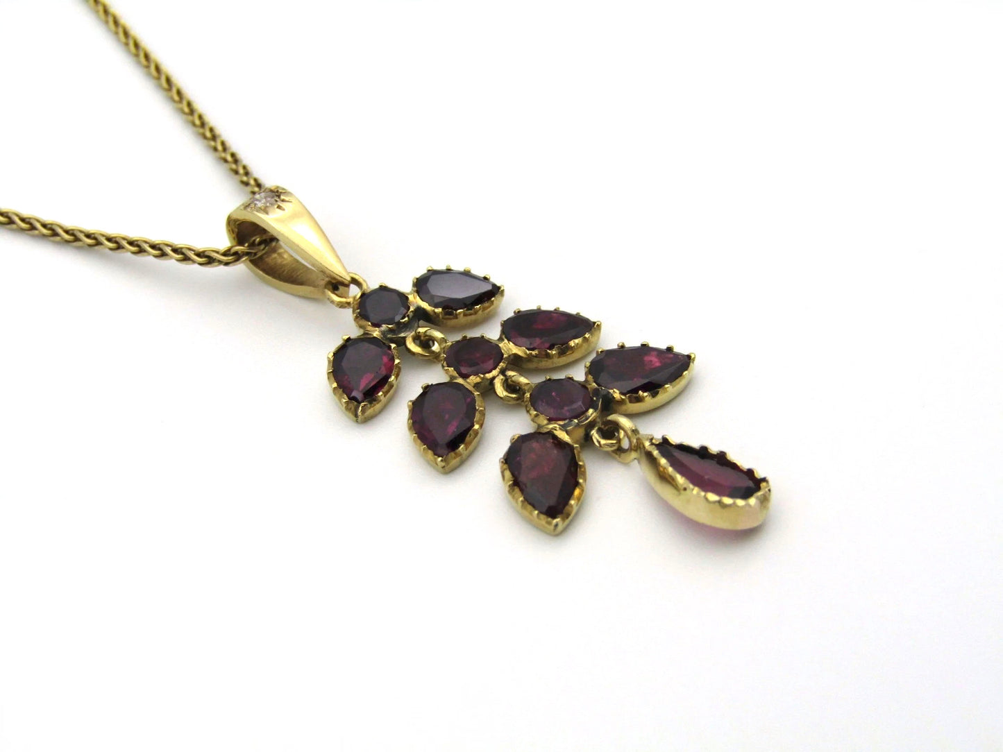 A Vintage 9K gold Almandine garnet and diamond pendant.
