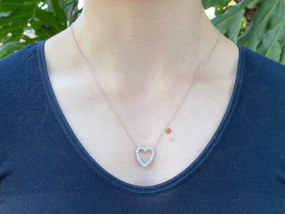 18K gold diamond heart necklace by Browns.