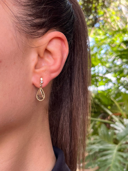 9K gold Vintage onyx and diamond dangle earrings, circa 1990's.