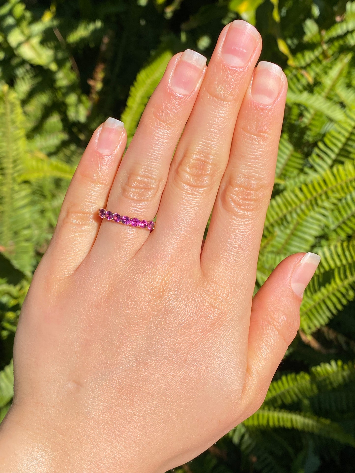 18K gold pink tourmaline half eternity ring.