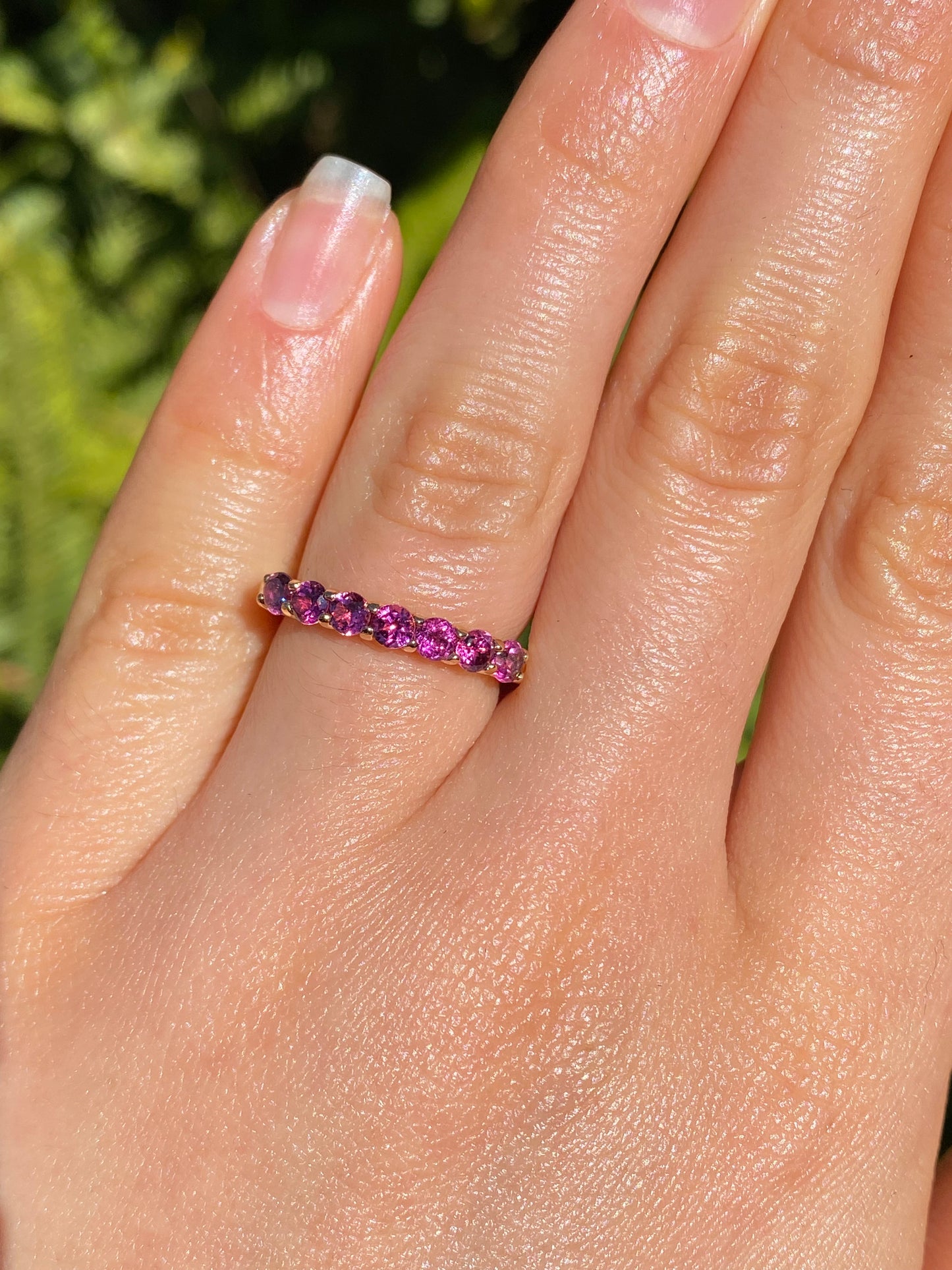 18K gold pink tourmaline half eternity ring.