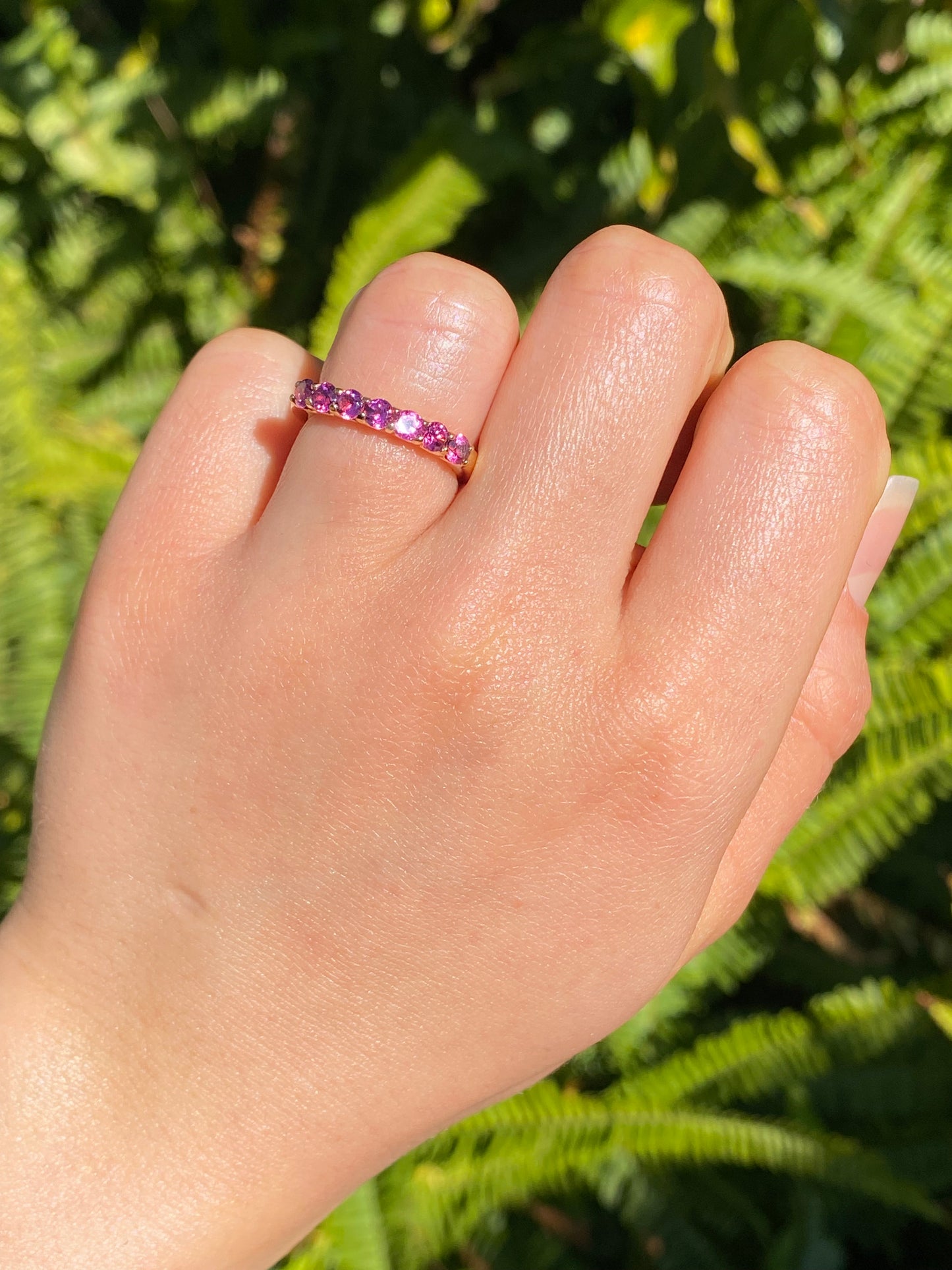 18K gold pink tourmaline half eternity ring.