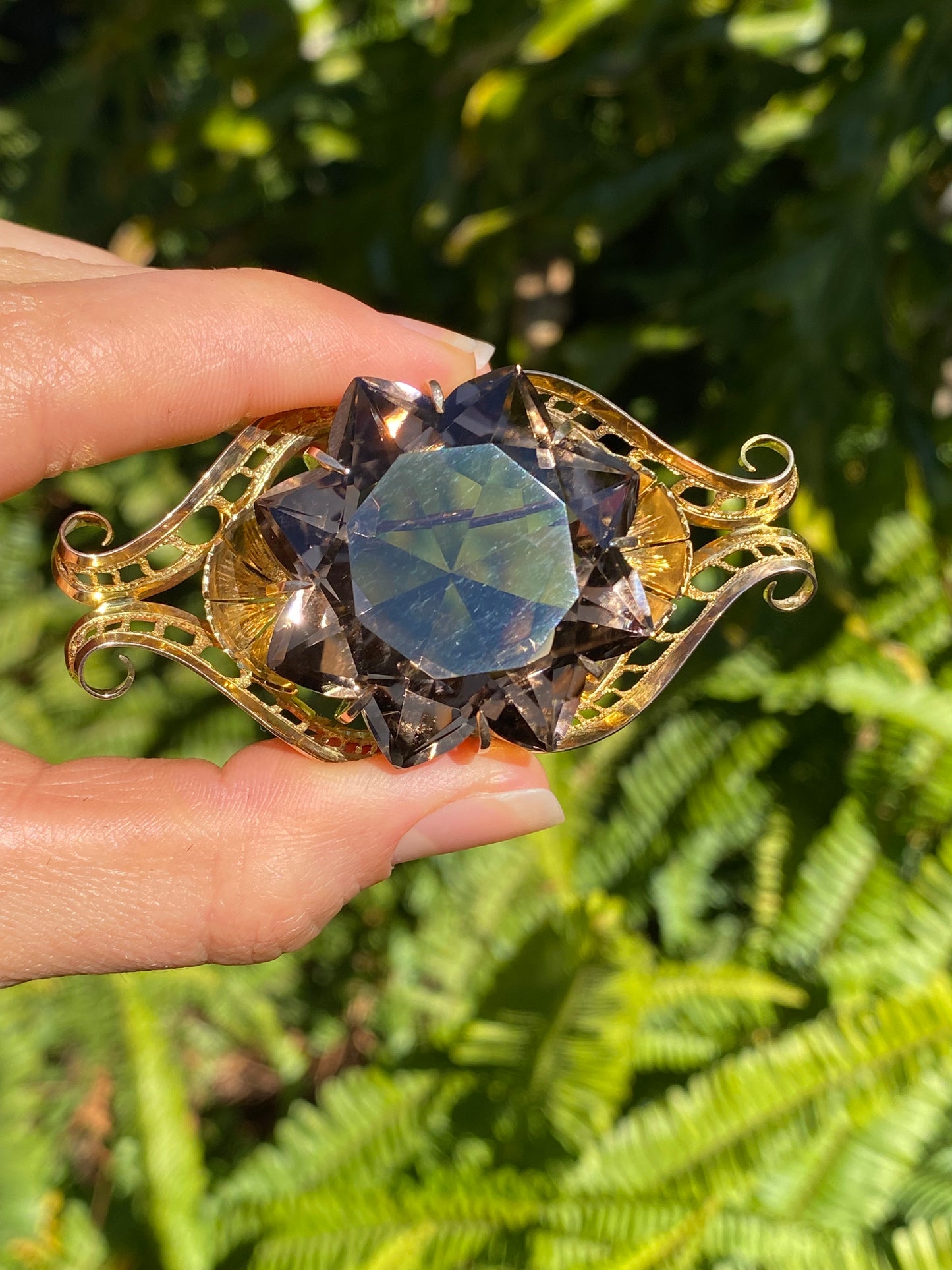 Large 9K gold smoky quartz brooch, circa 1950.