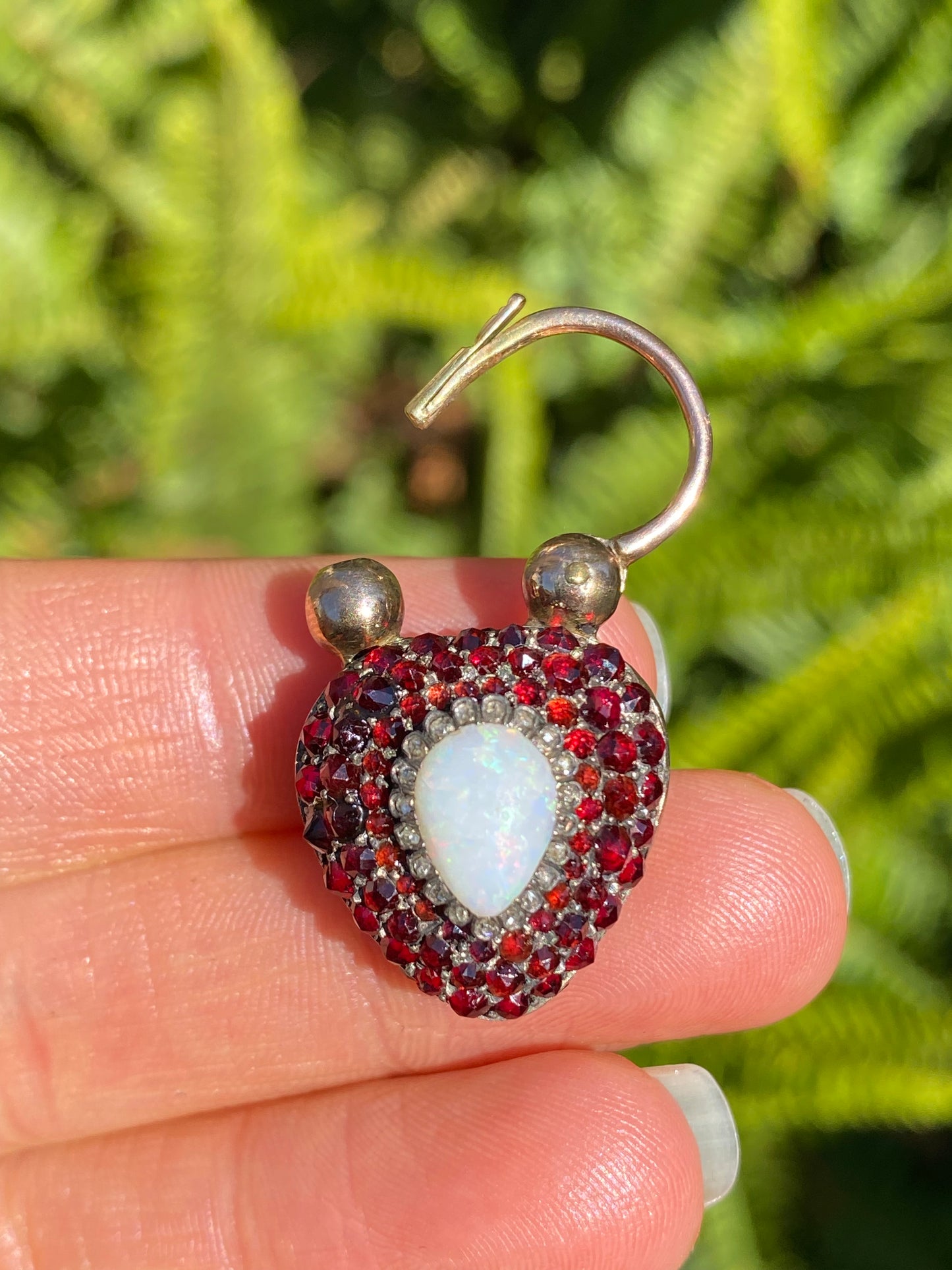 9K gold Victorian opal, garnet, seed pearl, and diamond locket and padlock clasp, circa 1850's.