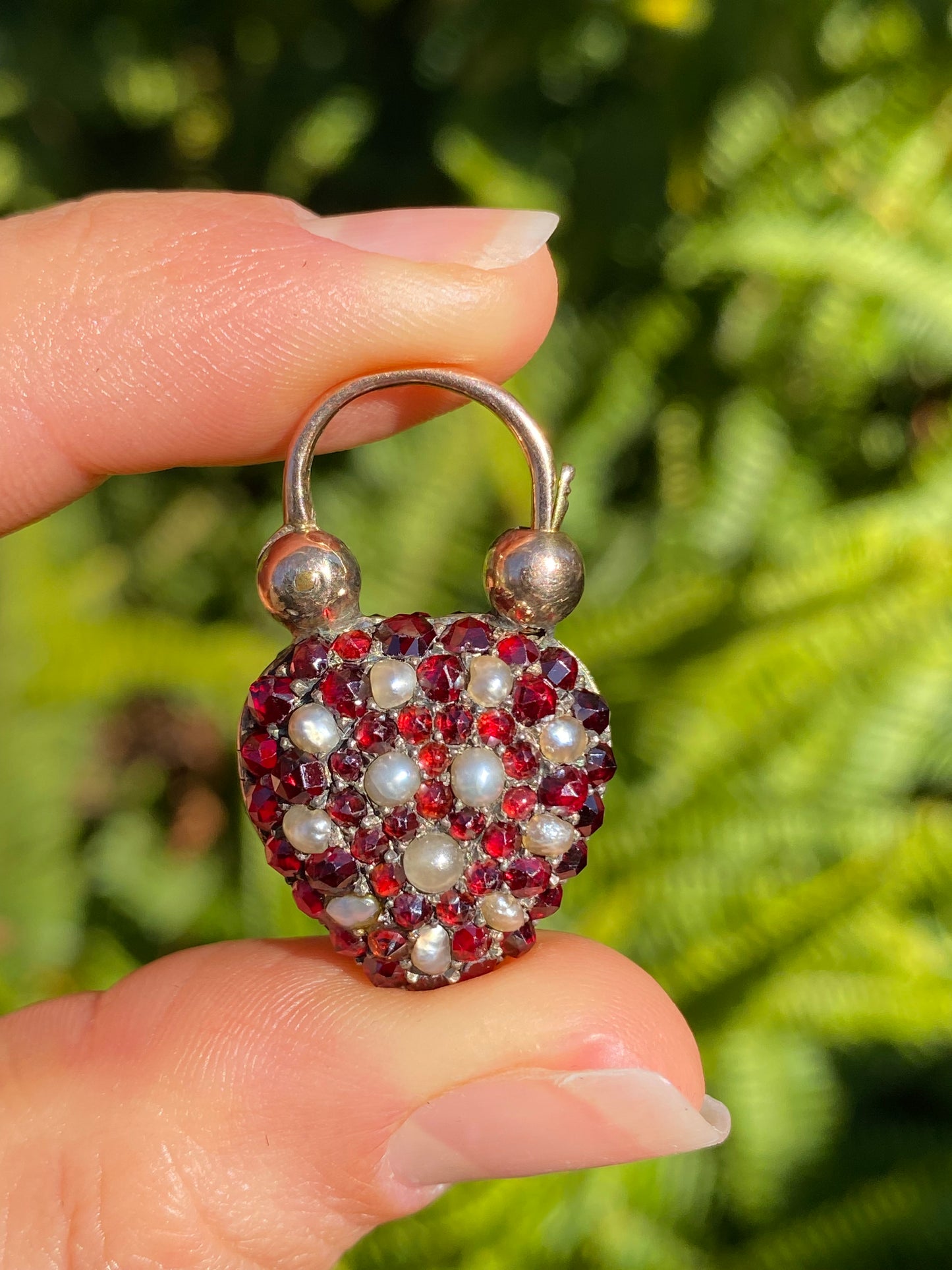 9K gold Victorian opal, garnet, seed pearl, and diamond locket and padlock clasp, circa 1850's.