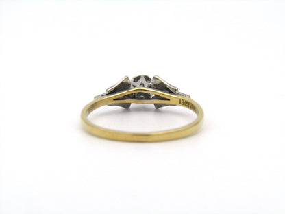 18K gold diamond ring.