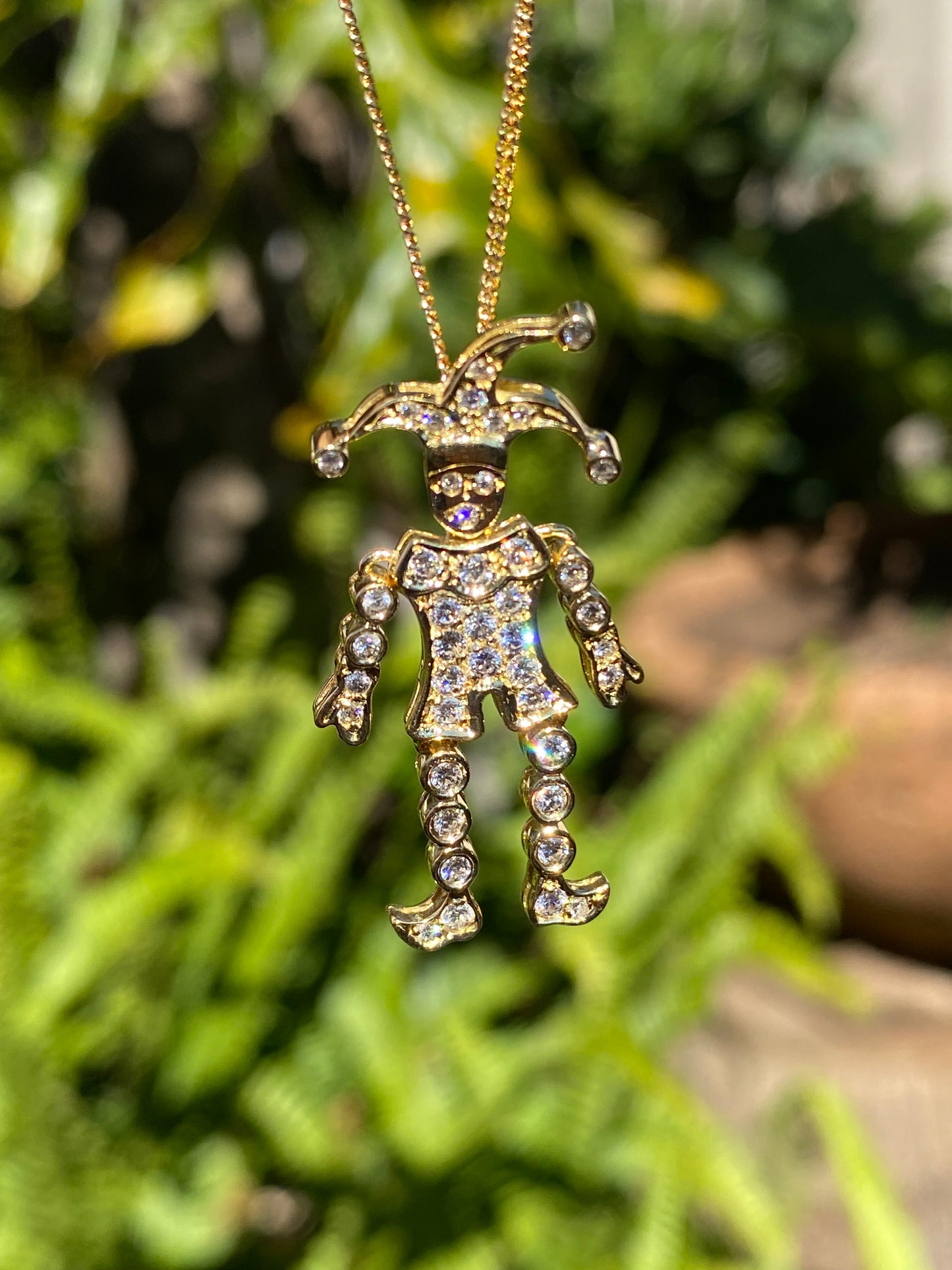 18K gold articulated diamond "Jester" pendant, circa 1980.