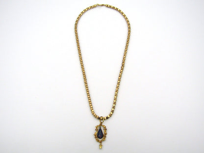 18K gold Georgian enamel, ruby, and seed pearl pendant with 18K gold popcorn chain by UnoAerre.