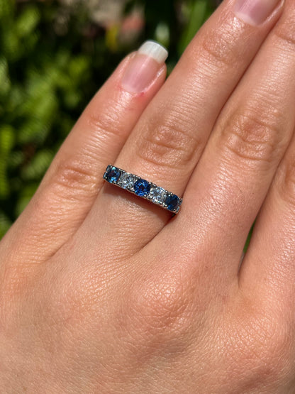 18K gold half eternity sapphire and diamond ring.