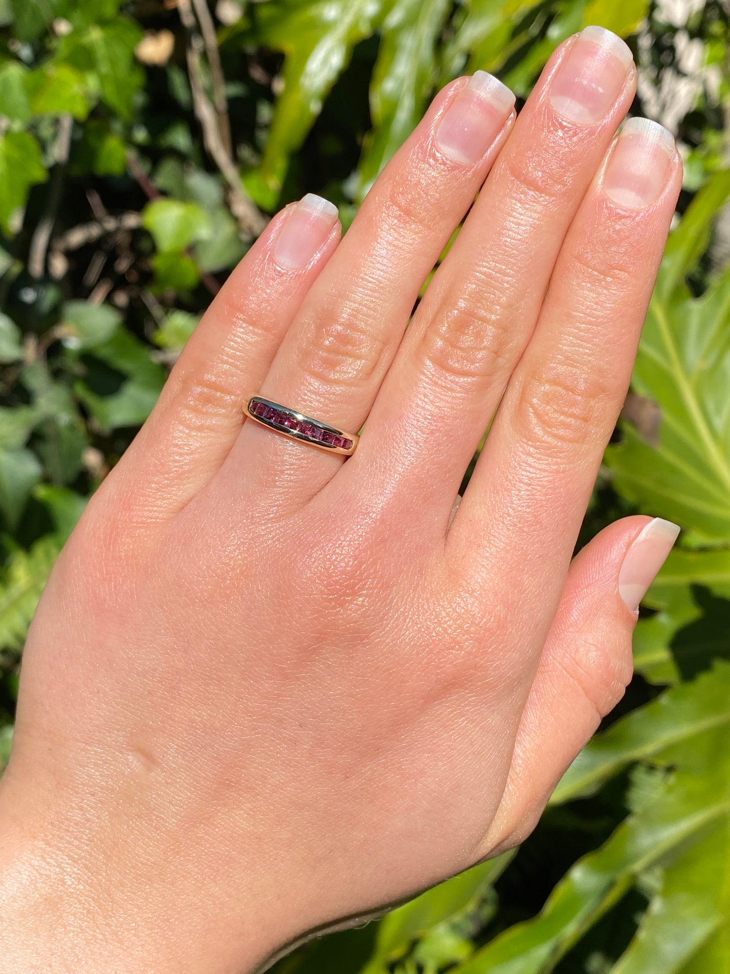 9K gold rhodolite garnet half eternity ring.