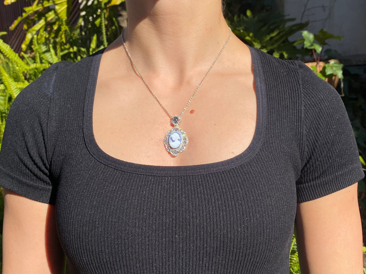 18K gold agate cameo, blue topaz and diamond pendant.