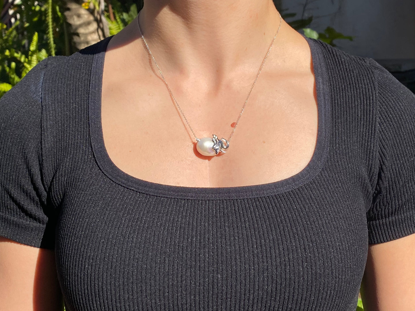 14K gold floating baroque pearl and diamond elephant necklace.
