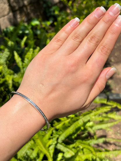 18K gold diamond bangle.