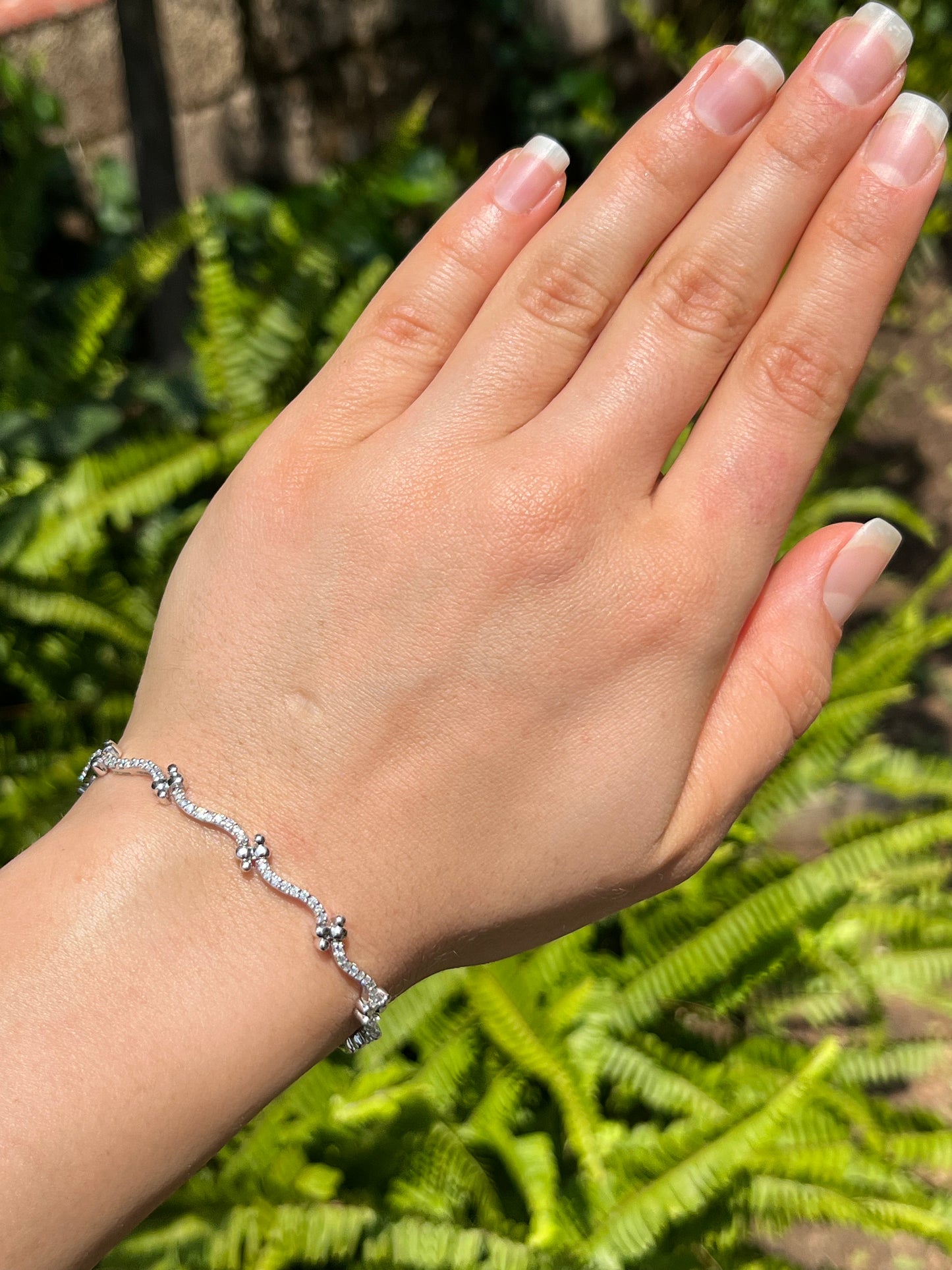 18K gold diamond wave link bracelet.