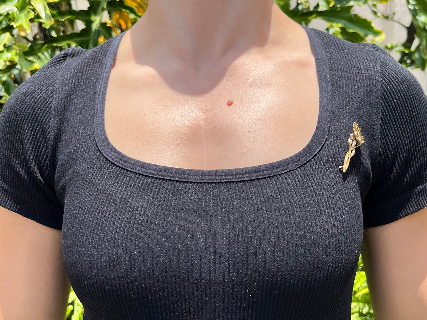 22K gold Edwardian ruby, diamond, and pearl sunflower brooch, circa 1900.