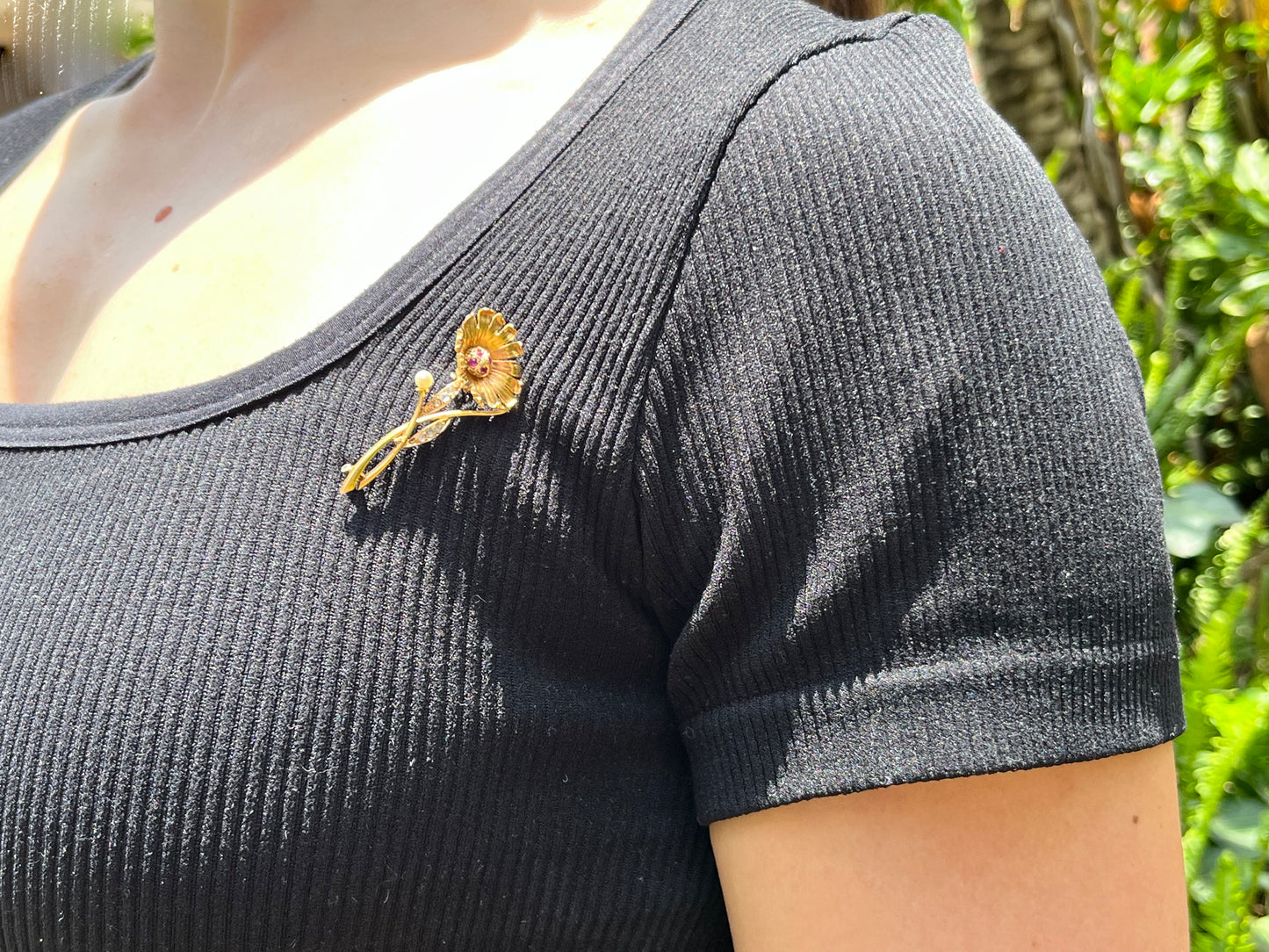 22K gold Edwardian ruby, diamond, and pearl sunflower brooch, circa 1900.