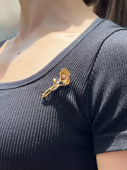 22K gold Edwardian ruby, diamond, and pearl sunflower brooch, circa 1900.