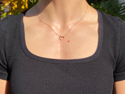 9K gold diamond heart pendant.