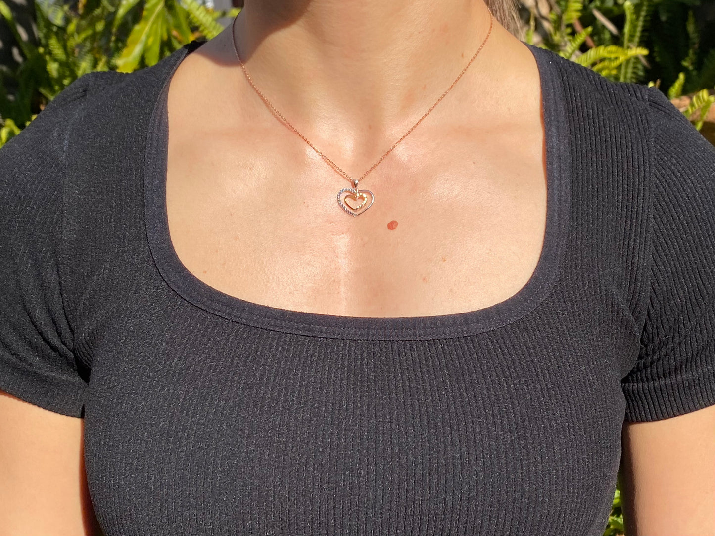 18K gold double-heart pendant.