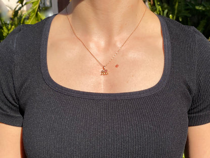 18K gold morganite and diamond elephant pendant.