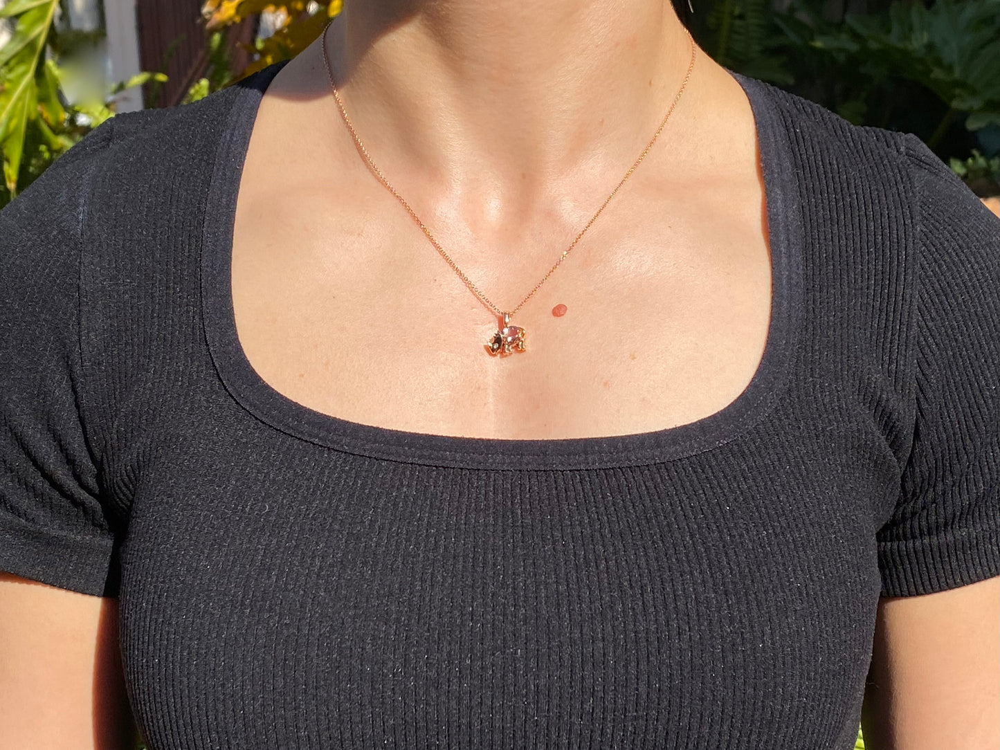 18K gold morganite and diamond rhino pendant.