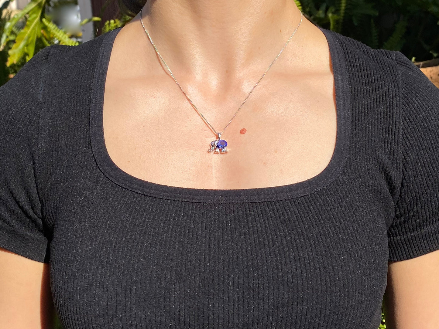 18K gold tanzanite and diamond elephant pendant.