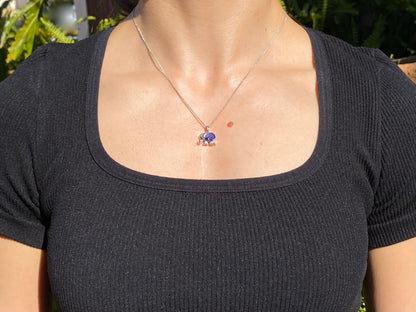 18K gold tanzanite and diamond elephant pendant.