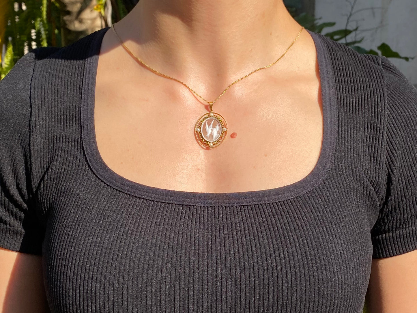9K gold conch shell cameo and cultured akoya pearl pendant.