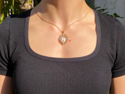 9K gold conch shell cameo and cultured akoya pearl pendant.