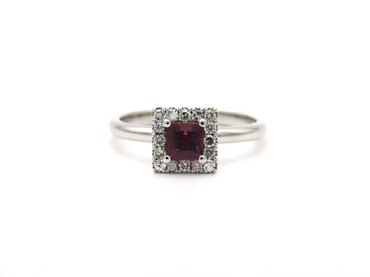 14K gold ruby and diamond halo ring.