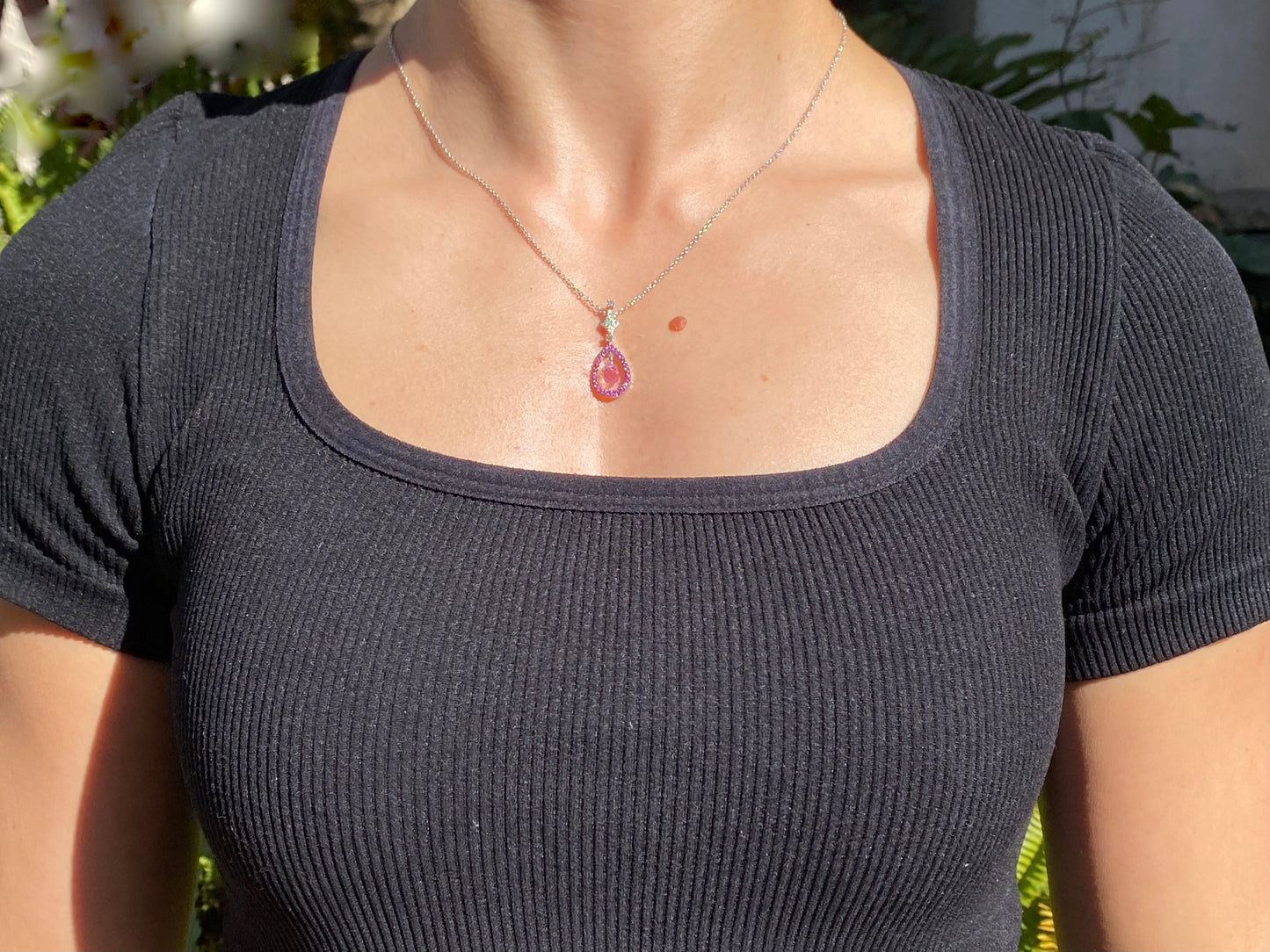 18K gold pink sapphire and diamond pendant.