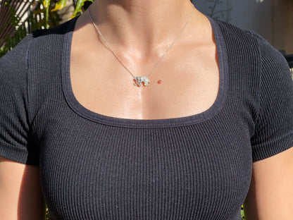18K gold diamond elephant necklace.
