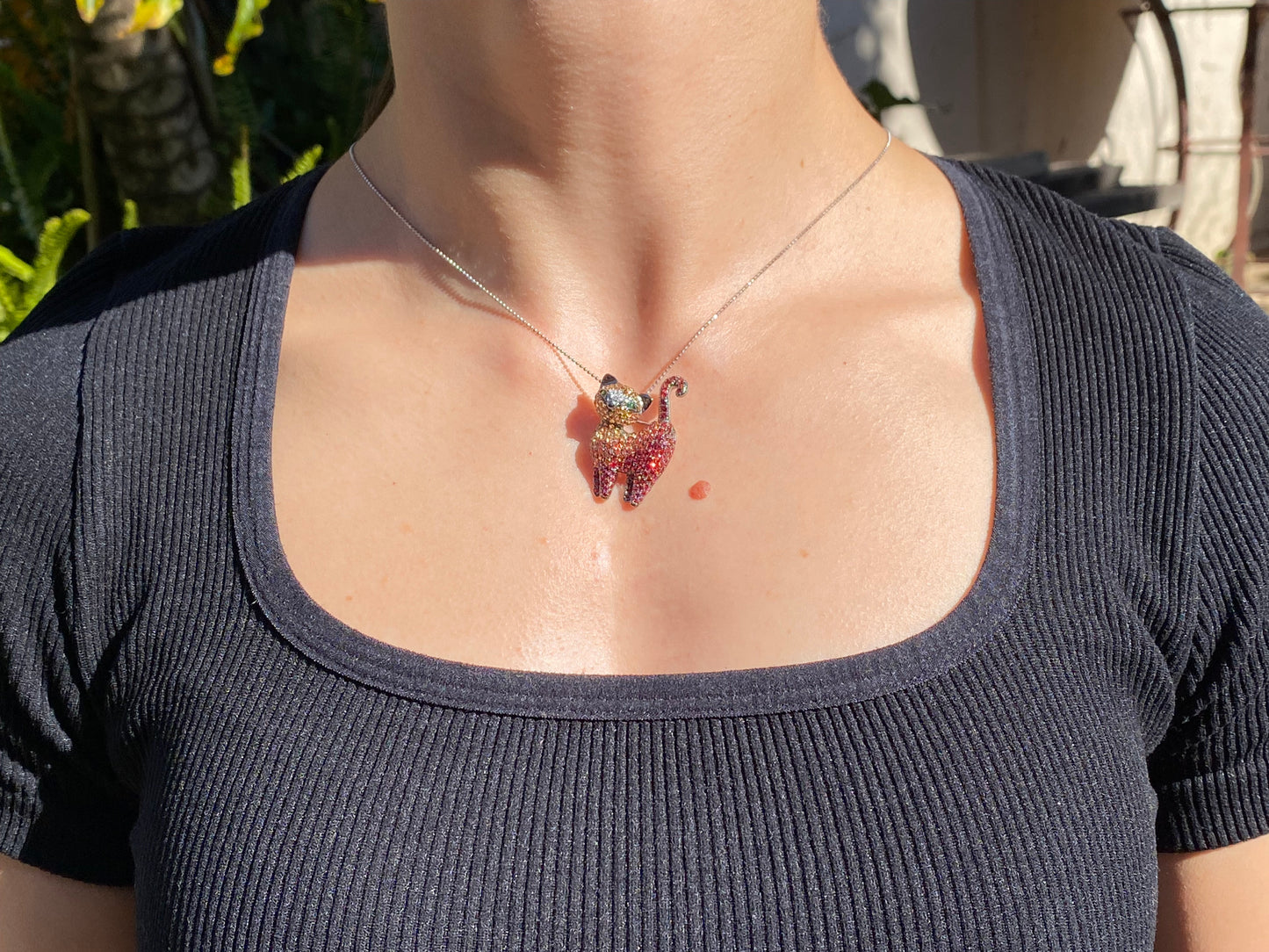18K gold fancy sapphire, tsavorite garnet and diamond cat pendant/brooch.