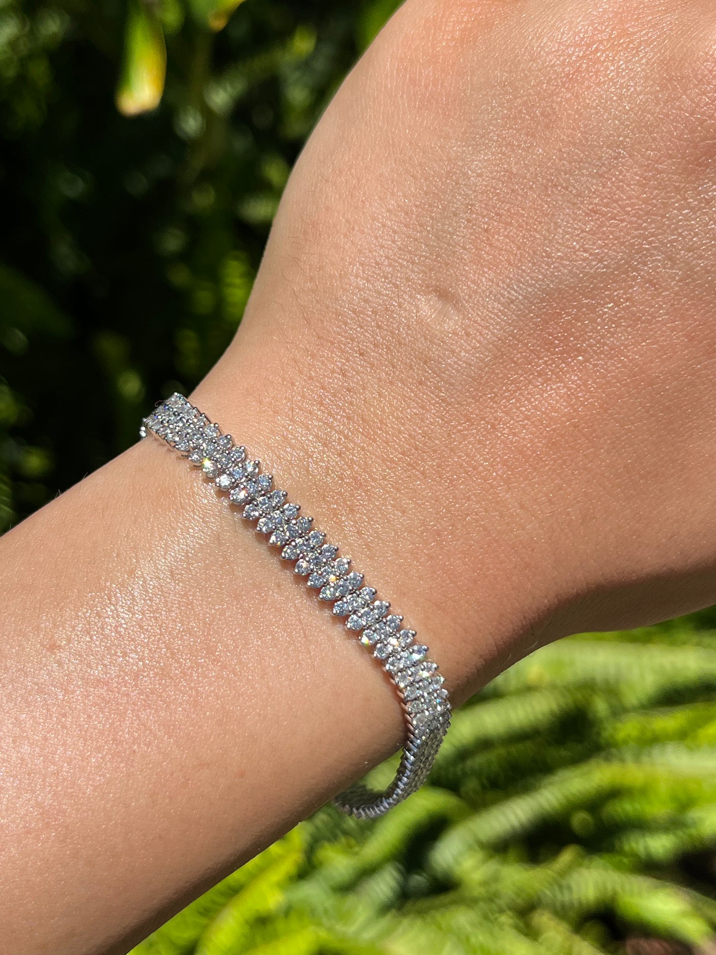 18K gold triple row diamond tennis bracelet.