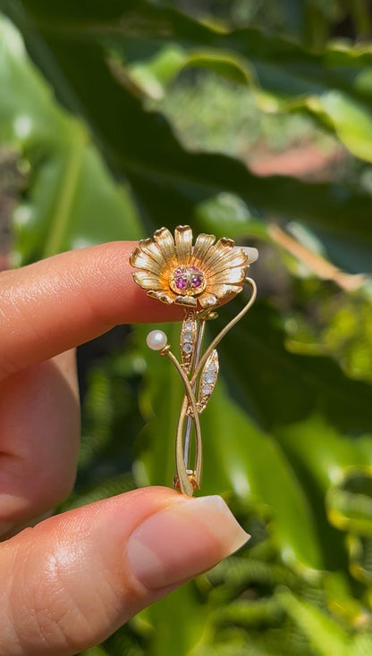 22K gold Edwardian ruby, diamond, and pearl sunflower brooch, circa 1900.