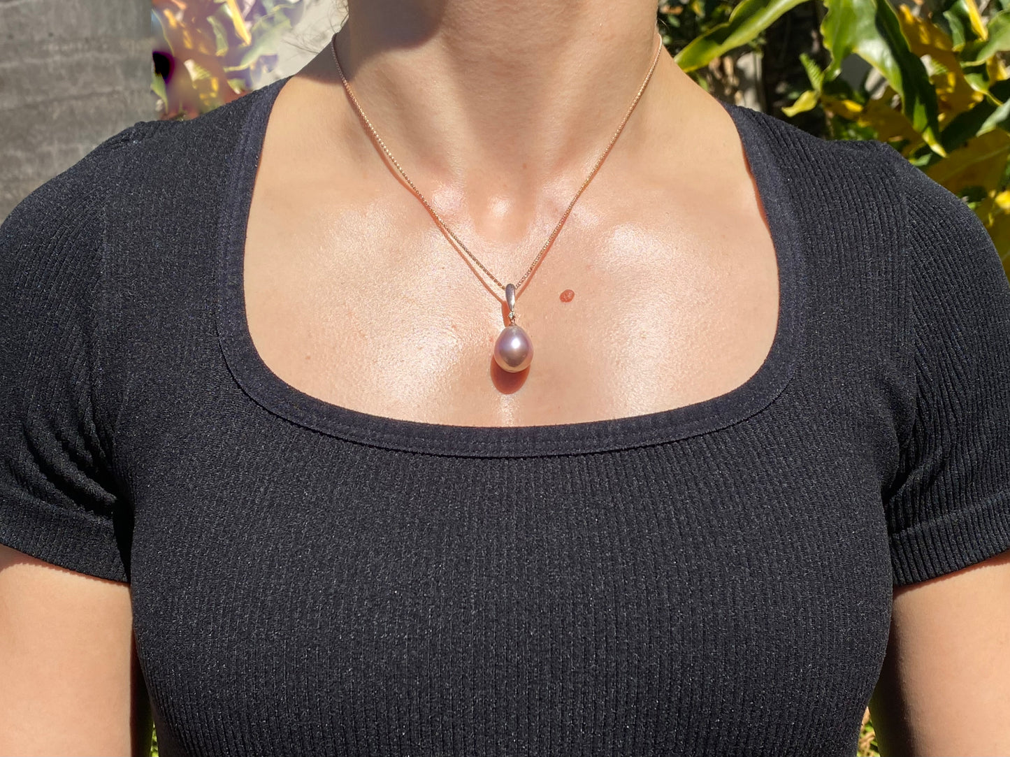 9K gold freshwater pearl and diamond pendant with 18K gold chain.
