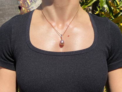 9K gold freshwater pearl and diamond pendant with 18K gold chain.