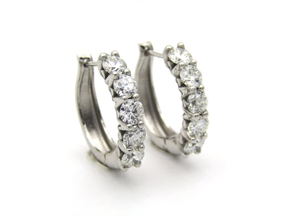 18K gold Diamond Protea huggie earrings by Browns.