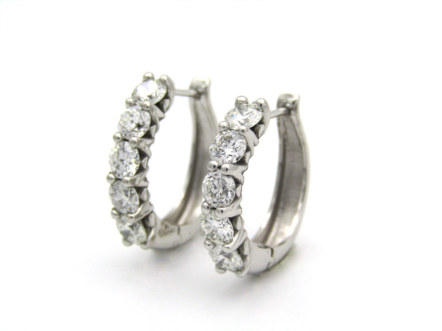 18K gold Diamond Protea huggie earrings by Browns.