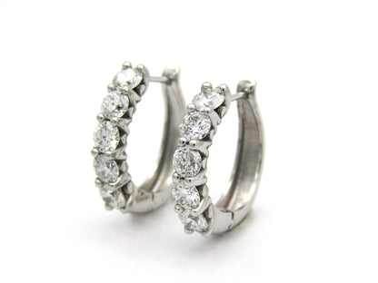 18K gold Diamond Protea huggie earrings by Browns.