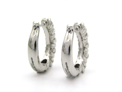 18K gold Diamond Protea huggie earrings by Browns.