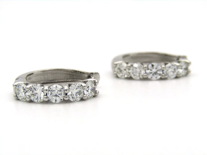 18K gold Diamond Protea huggie earrings by Browns.